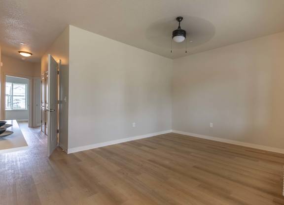 A room with wooden flooring and a white ceiling at Marcola Apartment Homes, Forest Grove, 97477