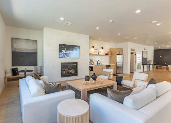 A modern living room with a fireplace and a television at Westgate Apartment Homes, Pendleton, 97801