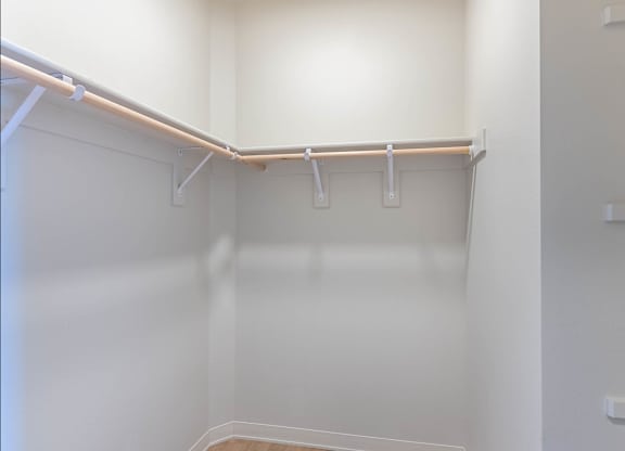 A white closet with a shelf and a white door at Westgate Apartment Homes, Pendleton, OR, 97801