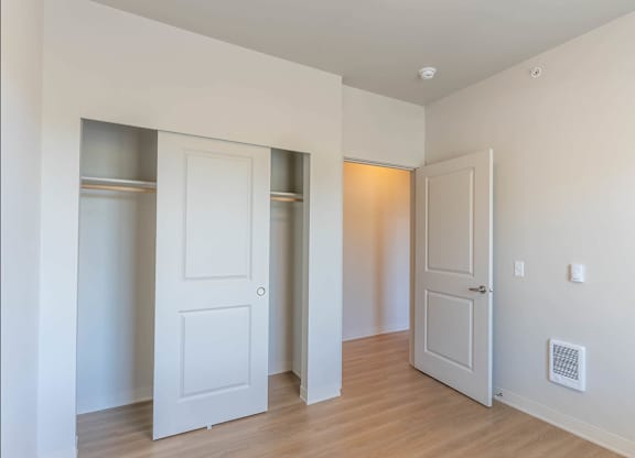 A room with two white doors and a wooden floor at Westgate Apartment Homes, Pendleton, 97801