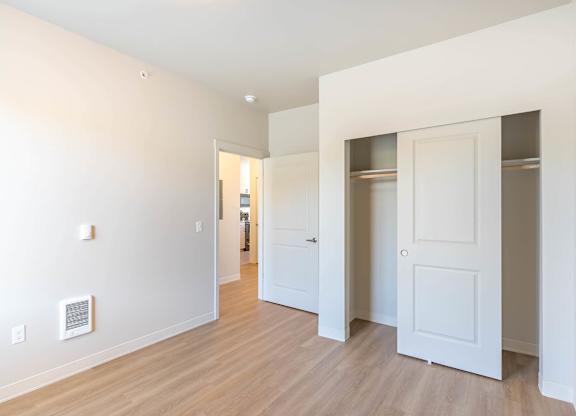 A white room with a door and a window at Westgate Apartment Homes, Pendleton, Oregon