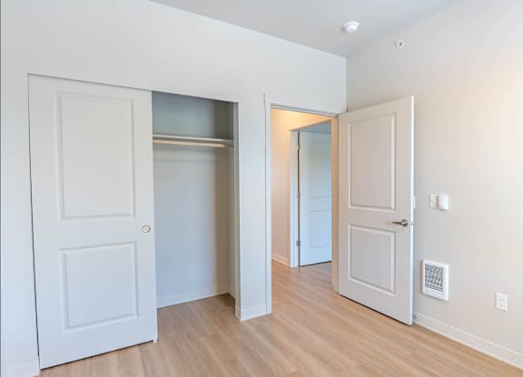 A white door is open to a hallway at Westgate Apartment Homes, Pendleton