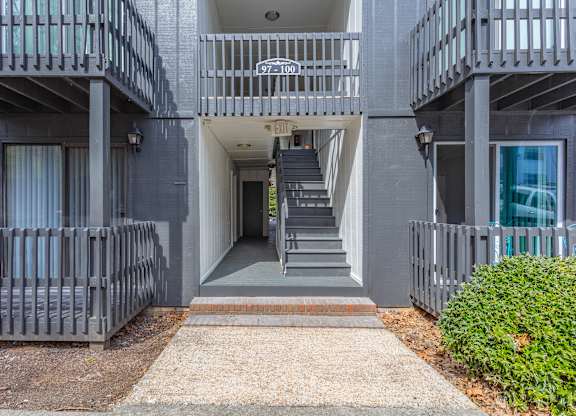 A building with a staircase leading to the entrance.