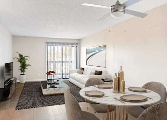 A modern living room with a dining table set for two.