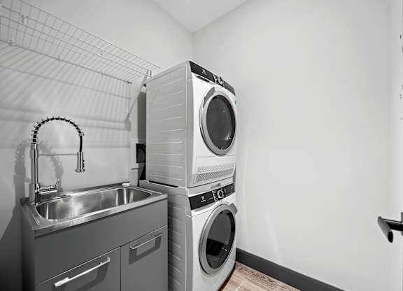 A modern laundry room at Damask, Windsor, ON