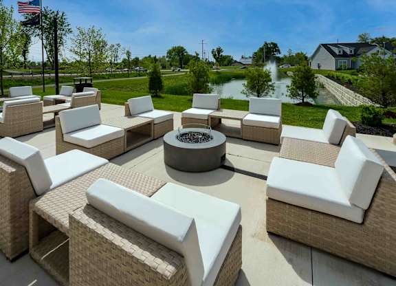 A large outdoor furniture set is arranged on a patio.