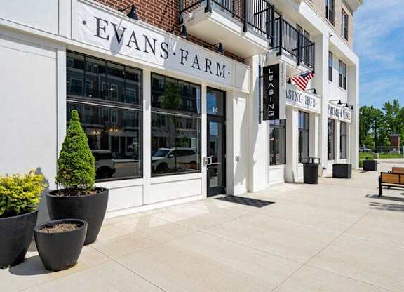 A white building with Evans Farm written on it.