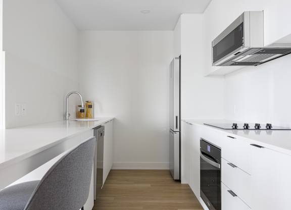 Modern Kitchen at Lynk De la Savane Apartments, Québec