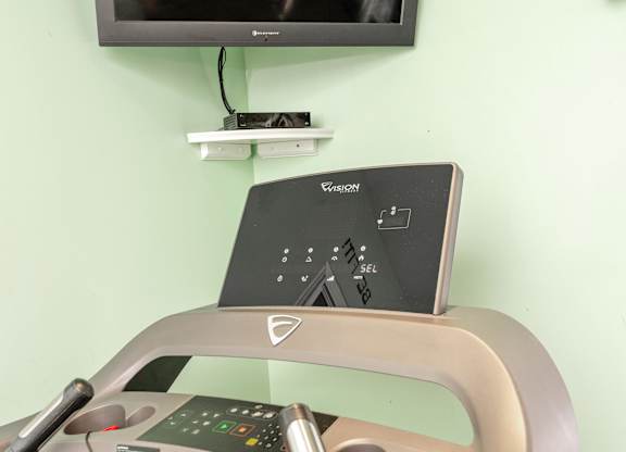 A treadmill with a control panel on top of it at Sawbranch Apartments, South Carolina
