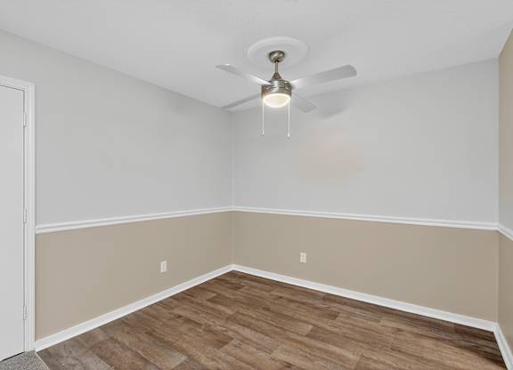 A room with a ceiling fan and light fixture at Sawbranch Apartments, Summerville 29485