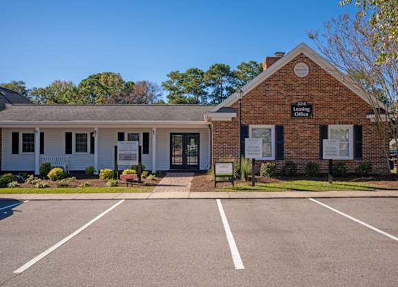 A small brick building with a sign  at The Preserve at Pine Valley Apartments, North Carolina, 28412