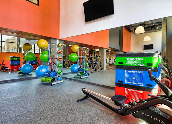 A gym with a variety of equipment including a rowing machine.at Eleven Fifty Clay Street, California, 94607