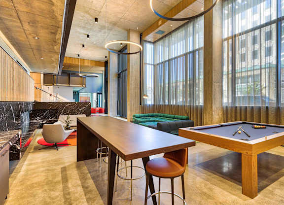 A room with a pool table and a bar area.at Eleven Fifty Clay Street, California  