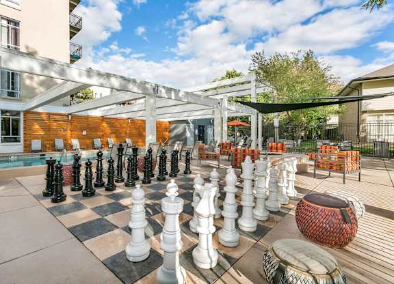 A giant chess set is set up on a patio. at The Lex At Lowry, Denver, CO, 80224