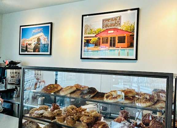 A bakery display case filled with various baked goods.