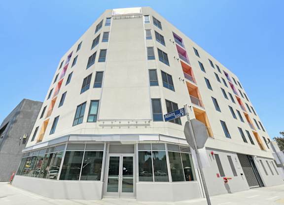 A white building with a blue sky in the background.