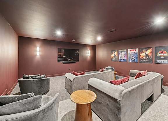 Room with grey couch and tv at 701 Hudson, Los Angeles, CA