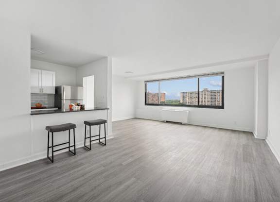 A Spacious Kitchen With Bar Stools at Ashlawn at Southern Towers, Alexandria, VA, 22311