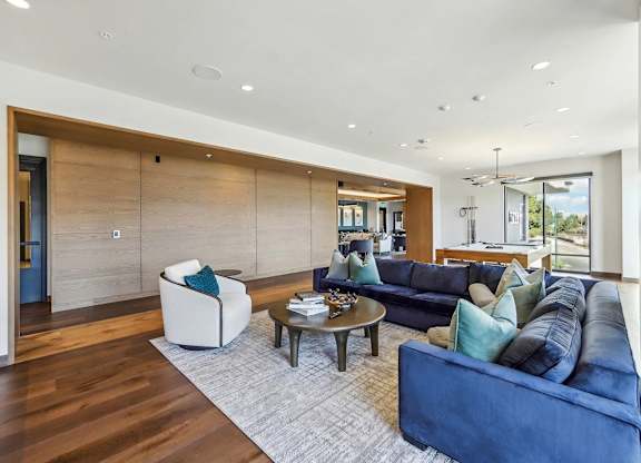 Living room with pool table at Bayview Apartments, California
