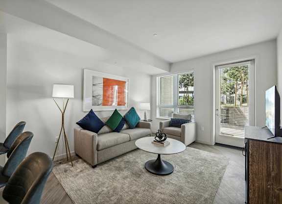 Living room with TV at Bayview Apartments, Emeryville, CA