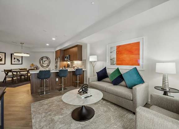 Living room with kitchen view at Bayview Apartments, Emeryville, CA