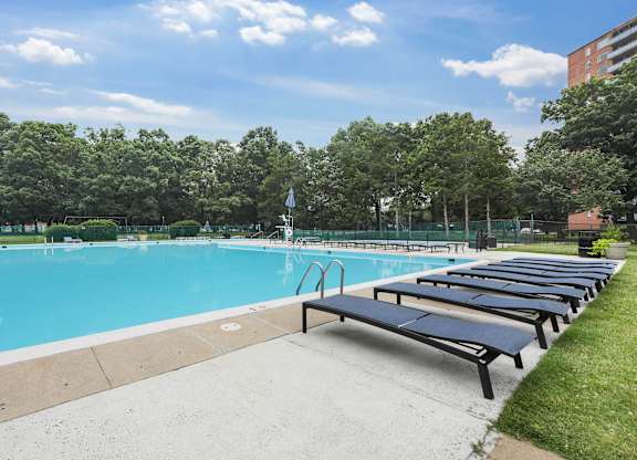 Swimming pool with sun loungers at The Graham at Southern Towers, Virginia, 22311