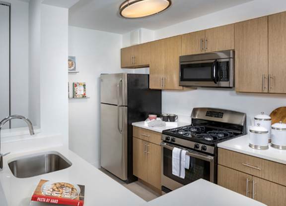Kitchen with stove top oven at The Graham at Southern Towers, Alexandria, Virginia, 22311