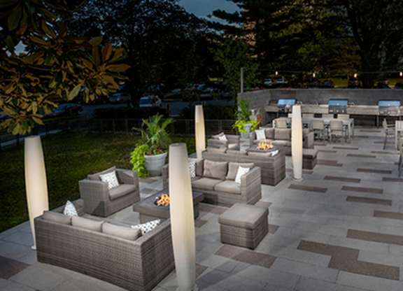 Outdoor picnic area with seating arrangement  at The Graham at Southern Towers, Alexandria, VA