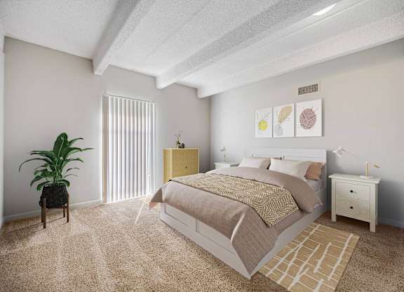 A bedroom with a bed, nightstand, and chair. at The Lex At Lowry, Denver, 80224