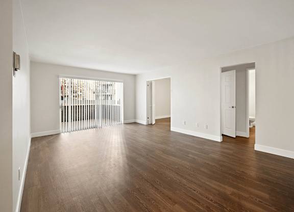 A room with wooden floors and white walls. at The Lex At Lowry, Colorado, 80224