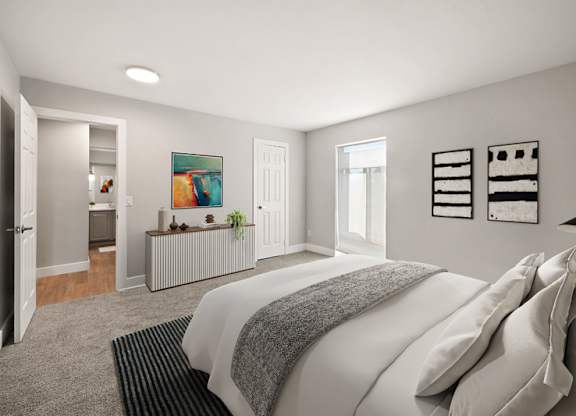 A bedroom with a large bed and a painting on the wall. at The Lex At Lowry, Denver, CO, 80224
