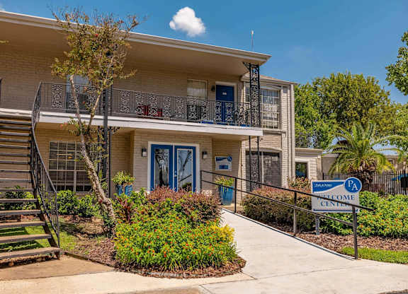 A building with a blue door and a sign that says