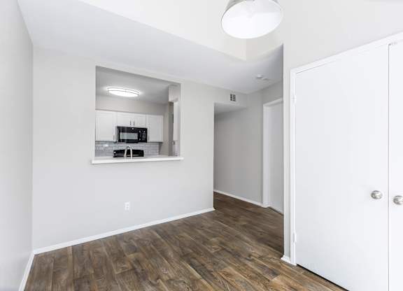 Open dining area with kitchen pass through window at Park at LeBlanc Apartments, Texas, 76132