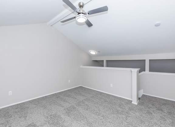Loft area with carpeted floor and vaulted ceiling at Park at LeBlanc Apartments, Texas, 76132