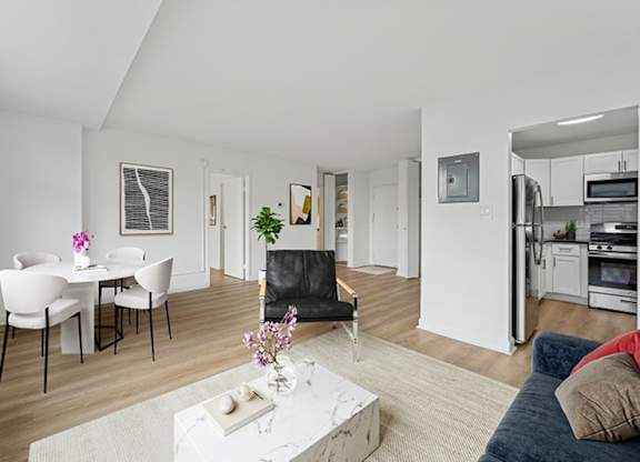 A modern living room with a dining table and chairs.at Sherwood at Southern Towers, Alexandria