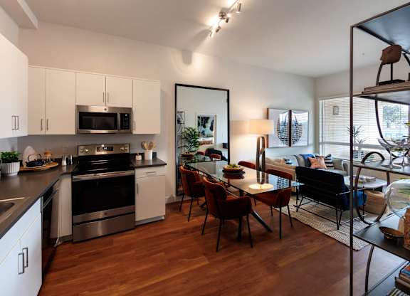 Kitchen with glass dining table at Sora Apartments, Inglewood, California