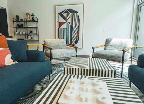 Bright living room with couch at Sora Apartments, Inglewood, California