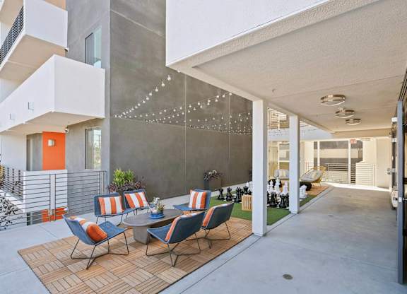 Common area with chairs and chess board at Sora Apartments, California, 90302