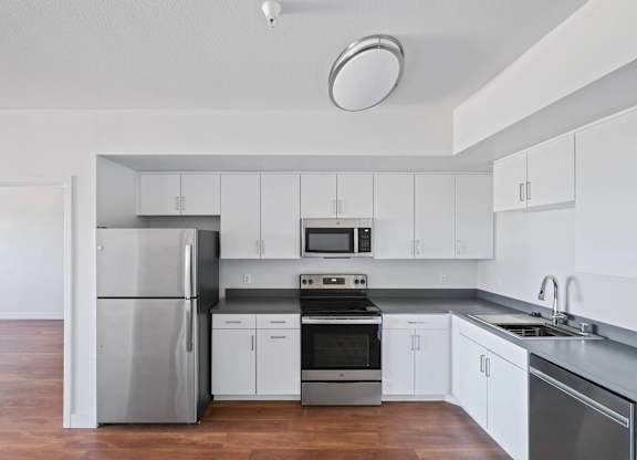 Kitchen with sink and white cabinetry at Sora Apartments, California, 90302
