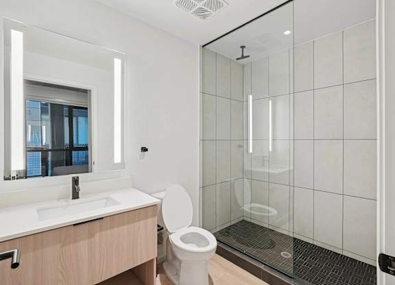 Bathroom with sink and mirror at Velaris Living Apartments, Denver