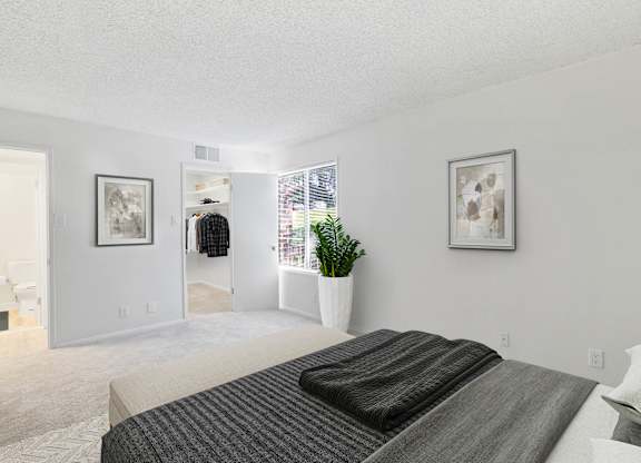 Bedroom with a walk-in closet at Vistas of Annandale, Virginia