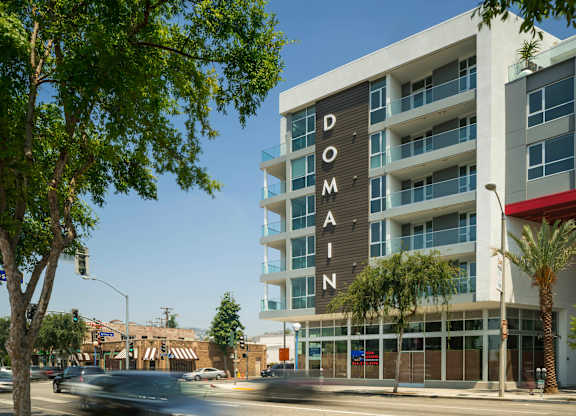 A tall building with the word "DOMAIN" on it.