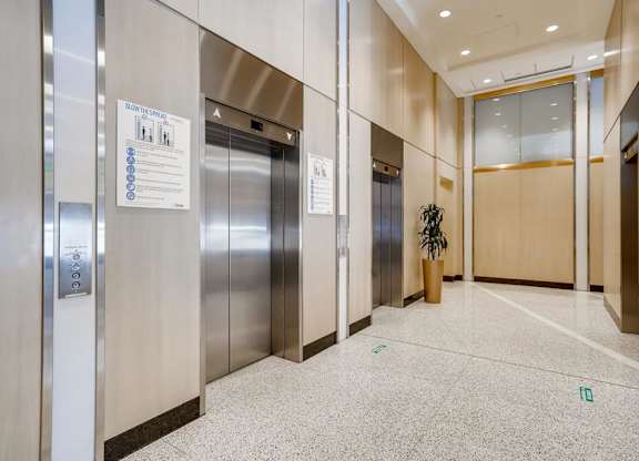 A sign on an elevator door instructs to