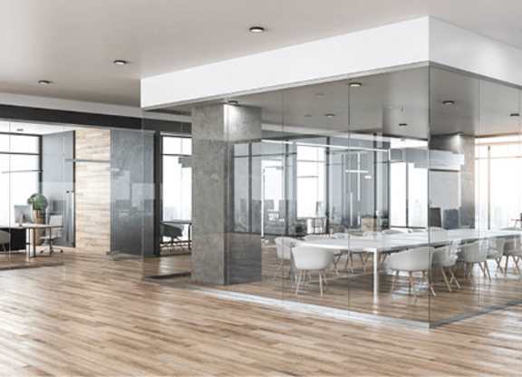 A modern conference room with a long table and chairs.