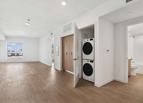 A laundry room with a washer and dryer in it.