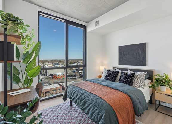 Bedroom with a comfortable bed at Velaris Living Apartments, Colorado, 80205