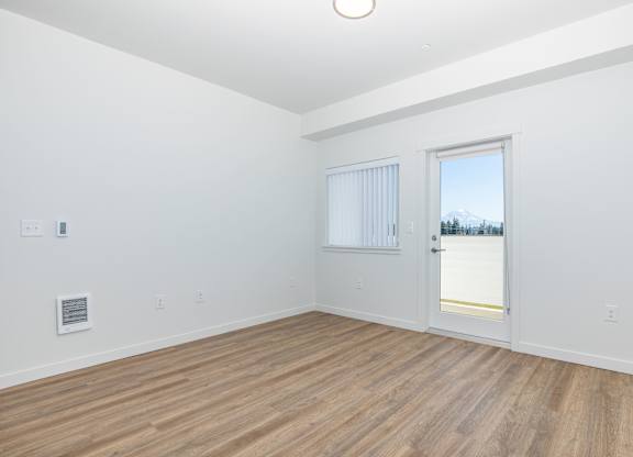 A room with a window and a door.