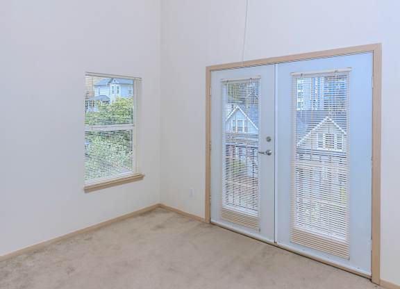 A room with a window and a door.