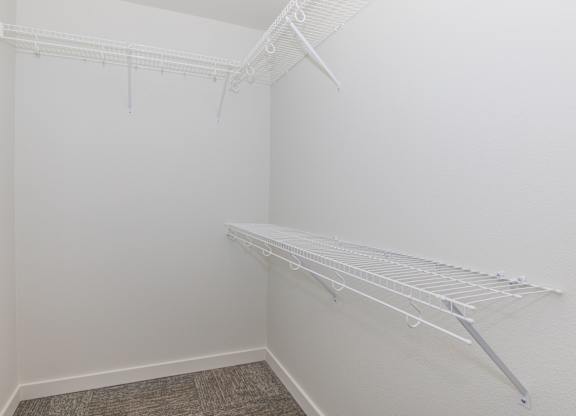 Empty white shelving unit in a room.