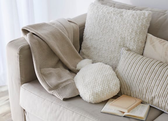 A room with a window and a mat on the floor.